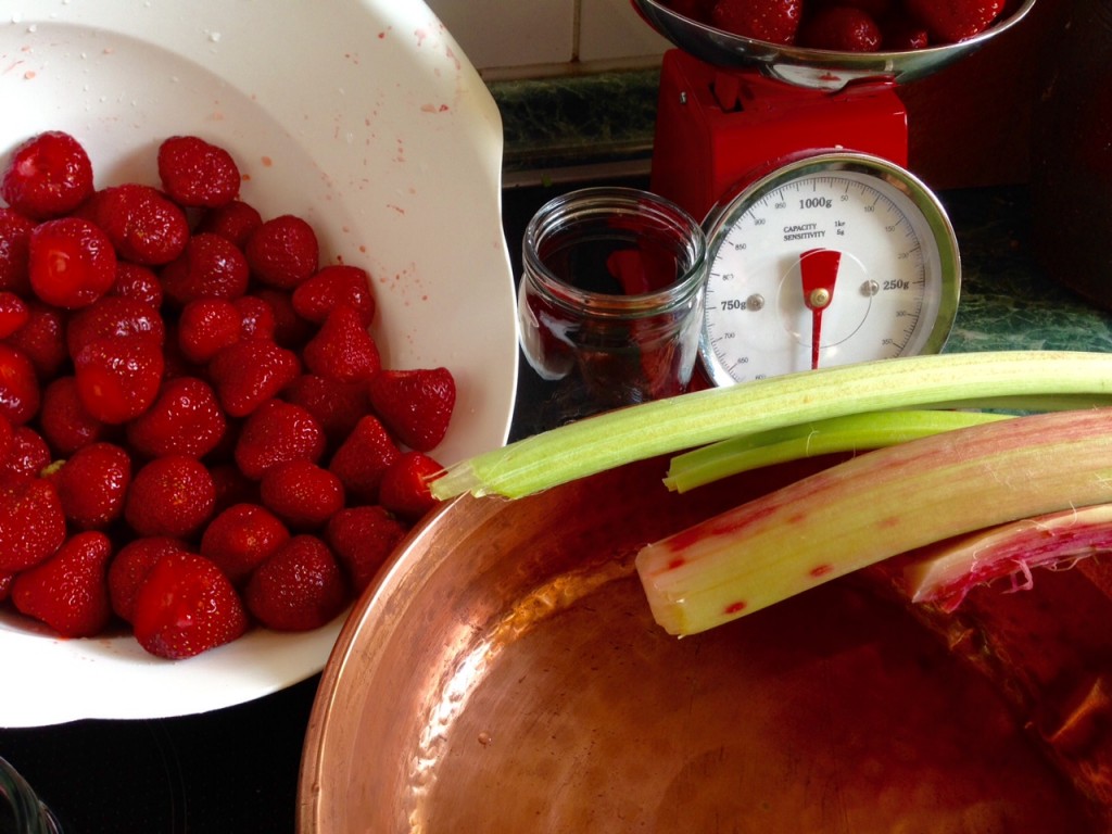 A bowl of strawberries ready to become jam. 