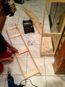 The husband assembling the new kitchen rack for the pantry God, I hate IKEA